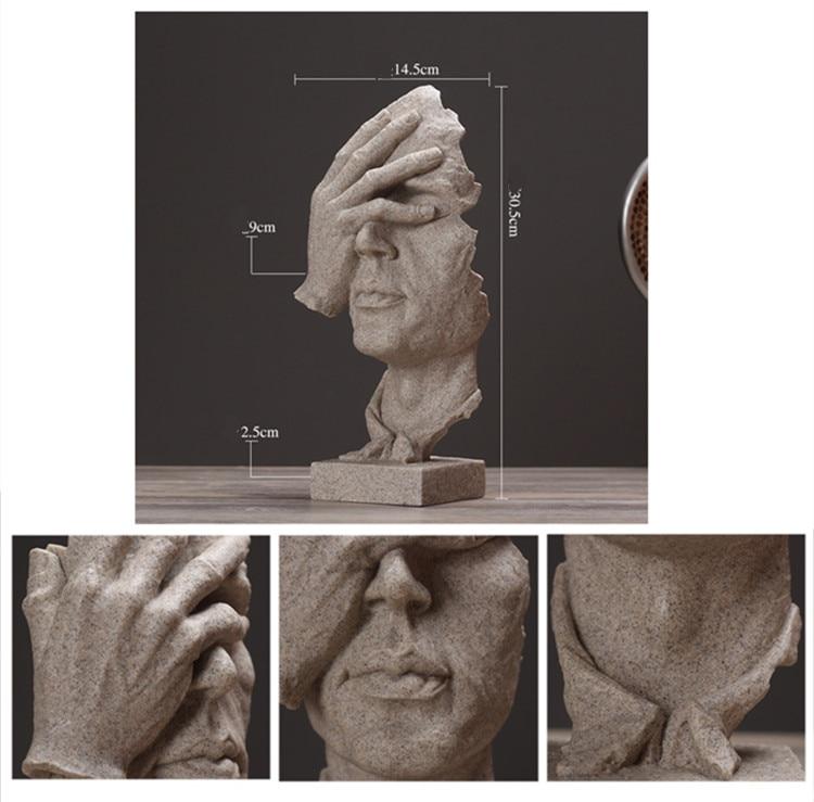 Rzeźba głowa z dłonią